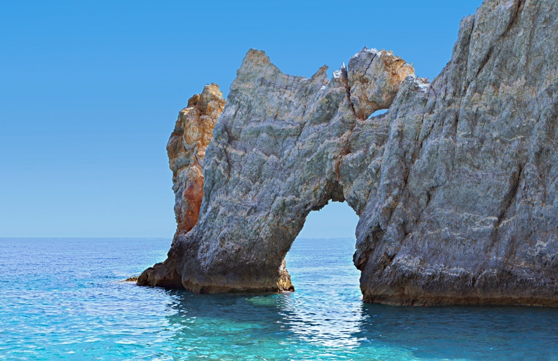 Lalaria beach and the famous holey rock at Skiathos island in Greece 
